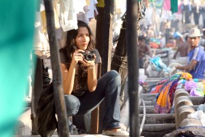 Monica Dogra taking photographs in the Mumbai laundry district.