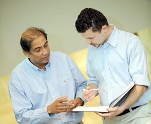 Dr. Ranjan Perera (left) with post-doctoral researcher Dr. Joseph Mazar. (Picture by Beaker Sanford Burnham)