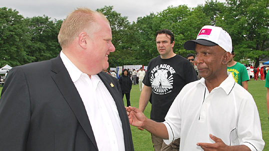 Mayor Ford shares a light moment with tournament organizer Ranil Mendis.