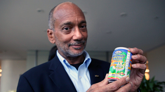 Douglas Orane, Chairman and Chief Executive Officer, GraceKennedy holds a can Coconut Water during his visit to Toronto. (Pictures by Mahesh Abeyewardene)