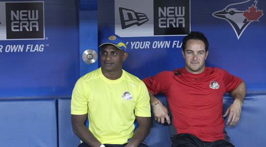 Former Sri Lankan cricketer Sanath Jayasuriya (left) and his South African counterpart Mark Boucher sit inside the Toronto Blue Jays dugout on Friday May 11, 2012. (Pictures by Mahesh Abeyewardene)