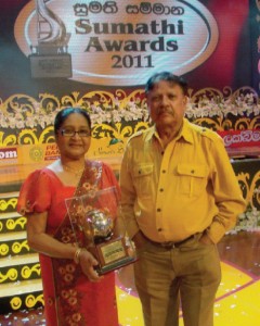 Sivanandan with actress anula Karunatilleke at the Sumathi awards held at the Sugathadasa indoor Stadium. Anula received lifetime achievement award.