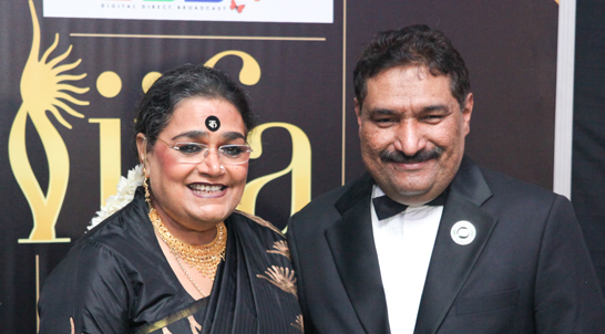 Indian singer Usha Uthap with the Director of IIFA Awards Sabbas Joseph in Singapore.