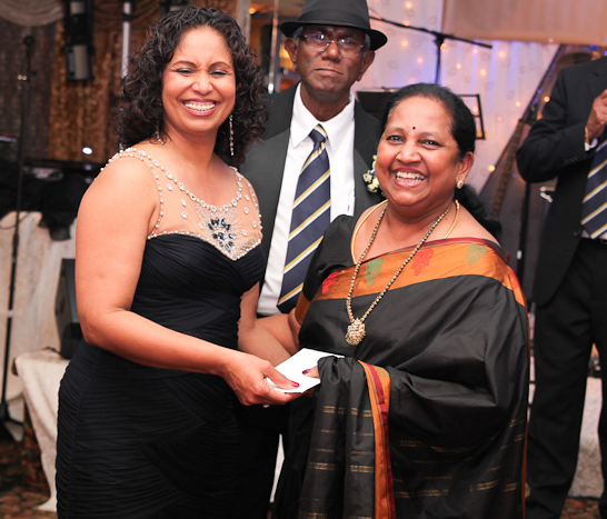 Lawyer Meleni David presents a raffle prize.