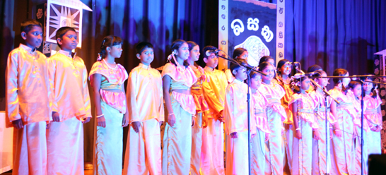 Children perform on stage at Basaka Waruna 2013.