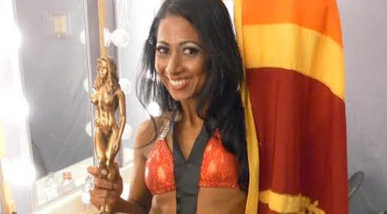 Sri Lankan-born fitness model Dhashi Perera Bartholomeusz with her fitness awards in Canada.
