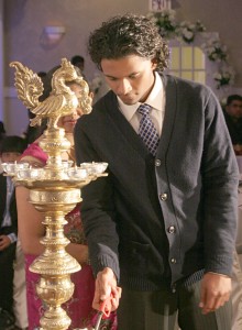 Stephan lights the oil lamp as a founding student during Markham Cricket Academy awards night in 2010.