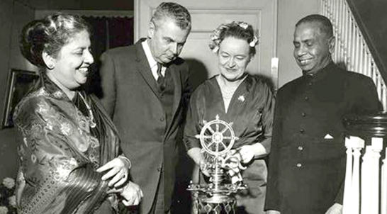 Canadian Prime Minister John Diefenbaker and his wife Olive lighting the traditional oil lamp at the Independence Day reception at the home of High Commissioner for Ceylon in Ottawa, with High Commissioner Sir Velupillai Coomaraswamy and Lady Coomaraswamy on February 4, 1960.