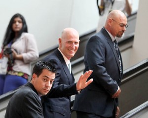 Florida Governor Rick Scott arrives for the press conference