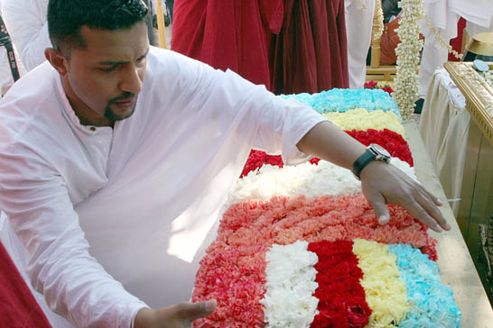 Floral tributes for the sacred Bodhi tree.