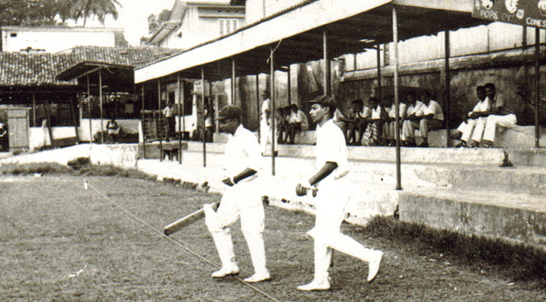 Christie Marathalingam and Dr. H I K Fernando set-off to bat for St. Peter's College at St. Benedict's College in Colombo during the 1950s.