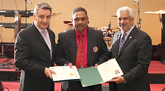 Elanko Rathnasabapathe, organizer of Silver Bells, is flanked by Paul Calendra, Parliamentary Secretary to the Prime Minister and to the Minister of Intergovernmental Affairs presenting a message from the Prime Minister of Canada Stephen Harper. MP Joe Daniel presents a message from Minister of Employment and Social Development and Minister for Multiculturalism. (Pictures by lankareporter)