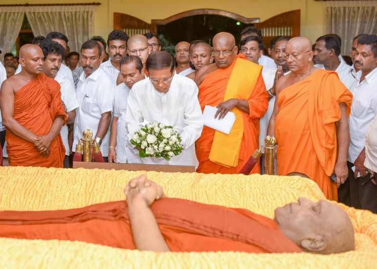 Sri Lankan President Siriesena pays respects Ven Sobitha. (Handout Photo Sri Lanka President's Office) 