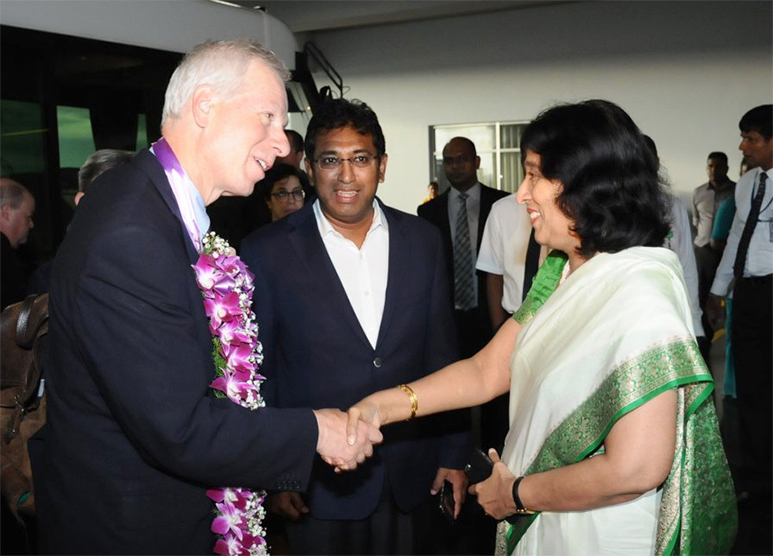 Dion shakes hands with Foreign Secretary Chitranganee Wagiswara who was the former Sri Lankan High Commissioner to Canada as Deputy Minister Harsha De Silva looks on.