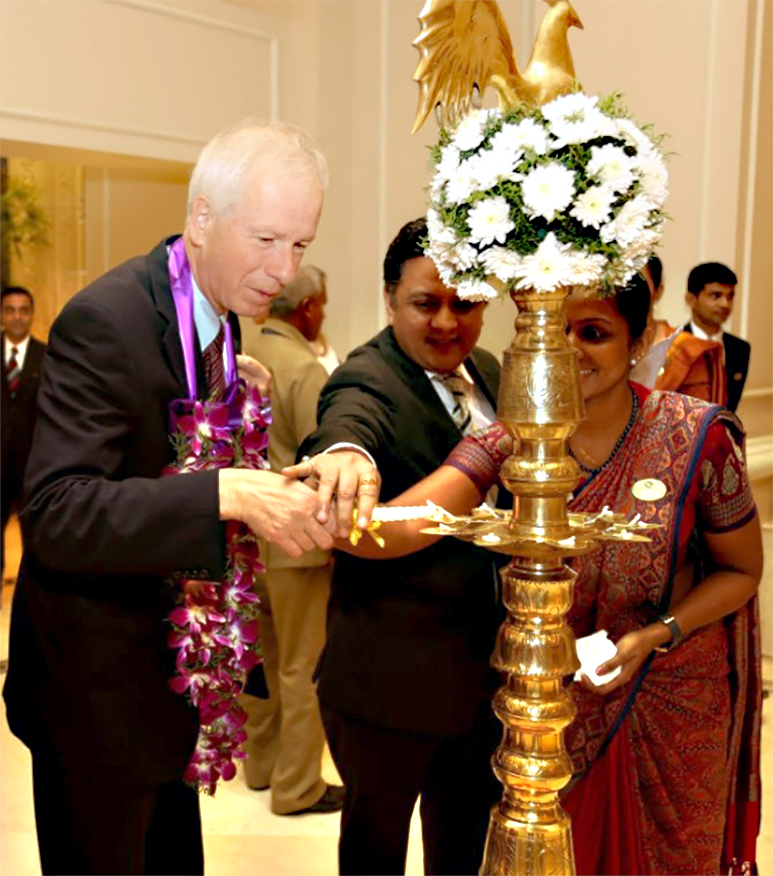 Foreign Minister Dion lights a traditional oil lamp at Taj Samudra Hotel in Colombo.