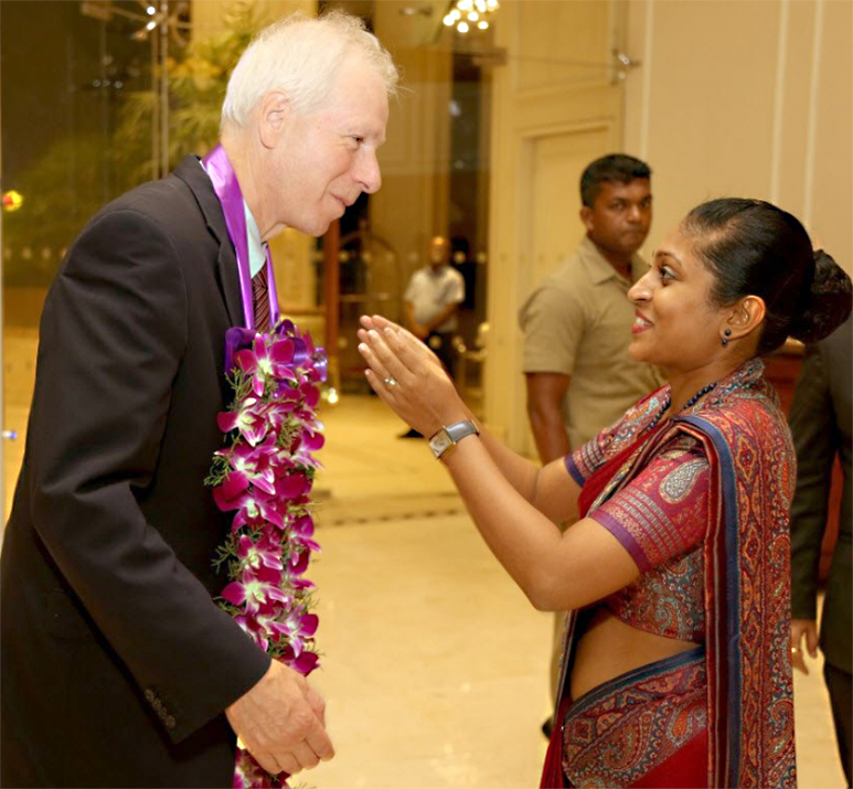 Foreign Minister Dion warmly recieves a garland at Taj Samudra Hotel in Colombo.