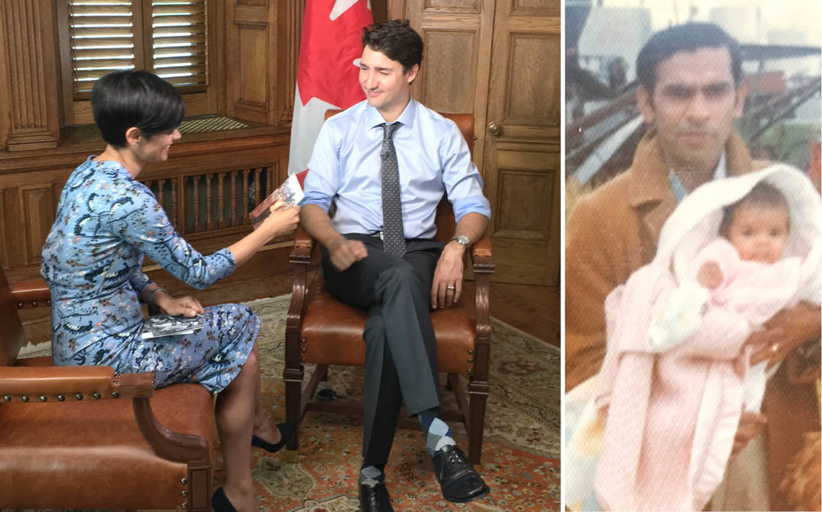 CTV’s Anne Marie Mediwake shows Canadian Prime Minister Justin Trudeau a photograph of her at the Saskatchewan border with her father.