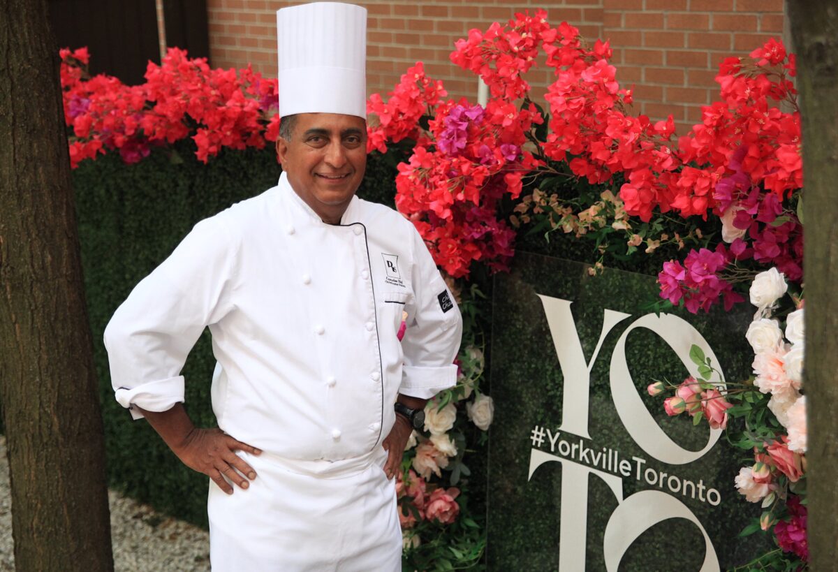 Christopher Perera stands outside the hotel.