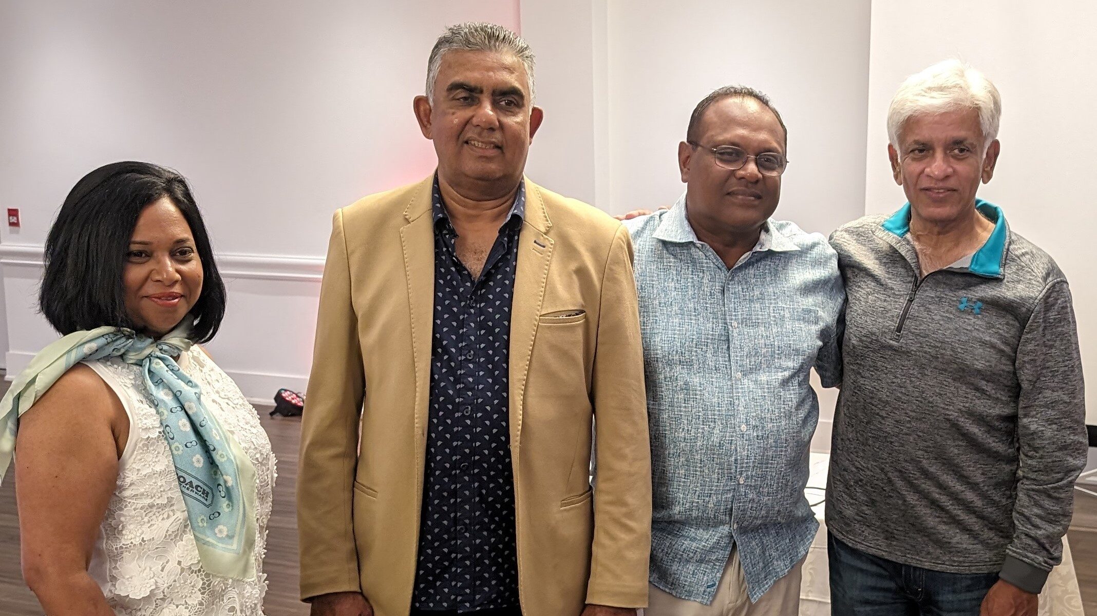 Arjuna Ranatunga and Asanka Gurusinghe pose for photos with guests.