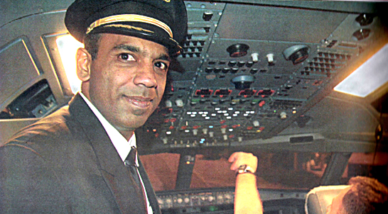 Captain Rajiv Veerasuntharam in the  cockpit at Toronto Perason Airport on Etihad airways' firs.t A340 flight.